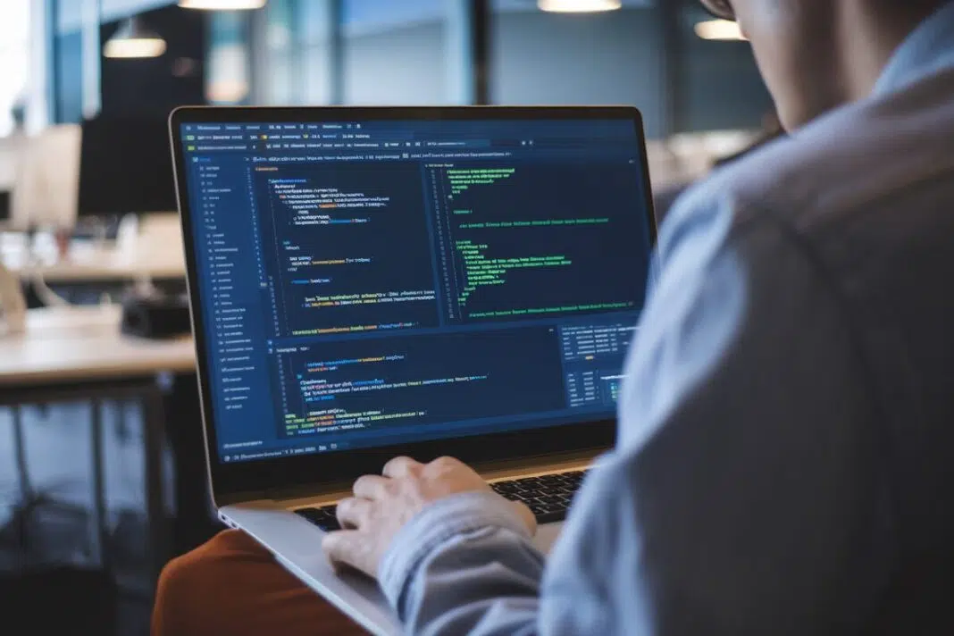 Développeur sur Android Studio Un développeur travaille sur Android Studio dans un bureau moderne